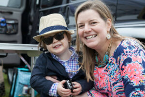 Woman with small child dressed up for the Foxfield Races