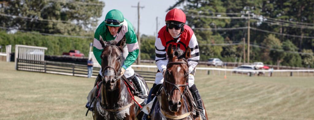 Horses racing neck to neck at foxfield.